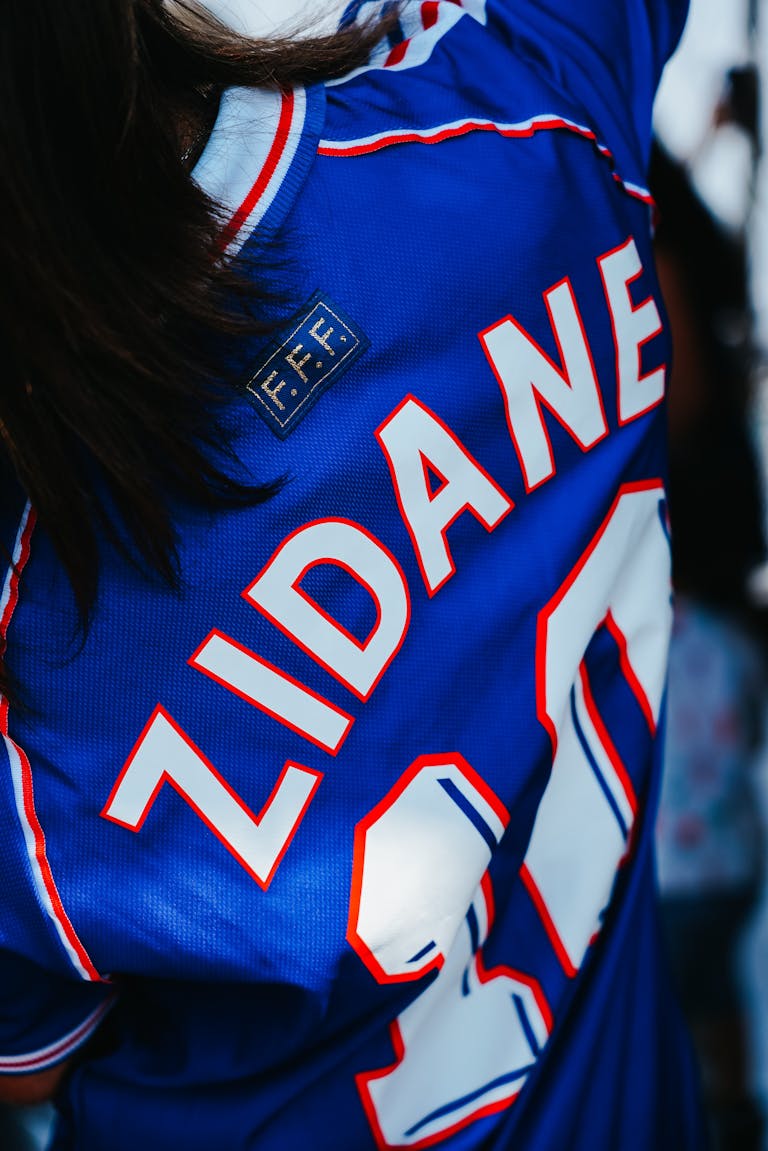 Detailed view of blue soccer jersey featuring a renowned player's name.